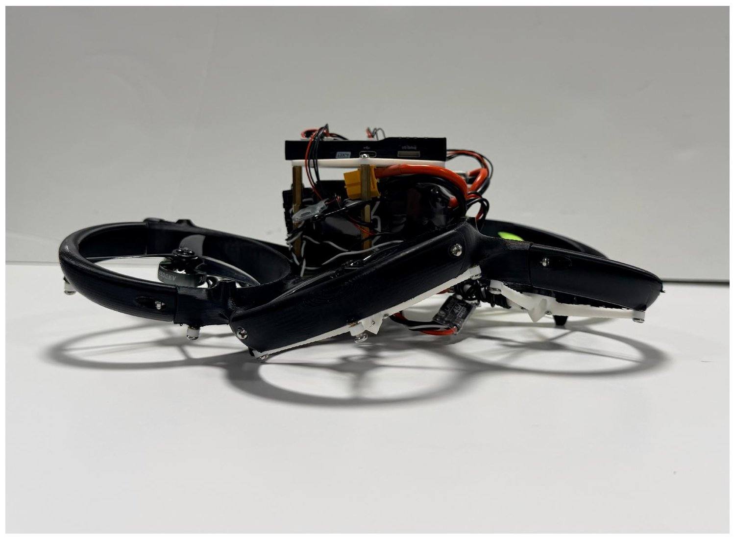 The finished drone from the side, props mounted and flight-ready